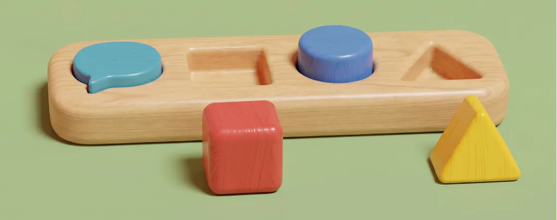 Wooden shape sorter with a speech bubble, square, circle and triangle slot, each block next to the opening it fits